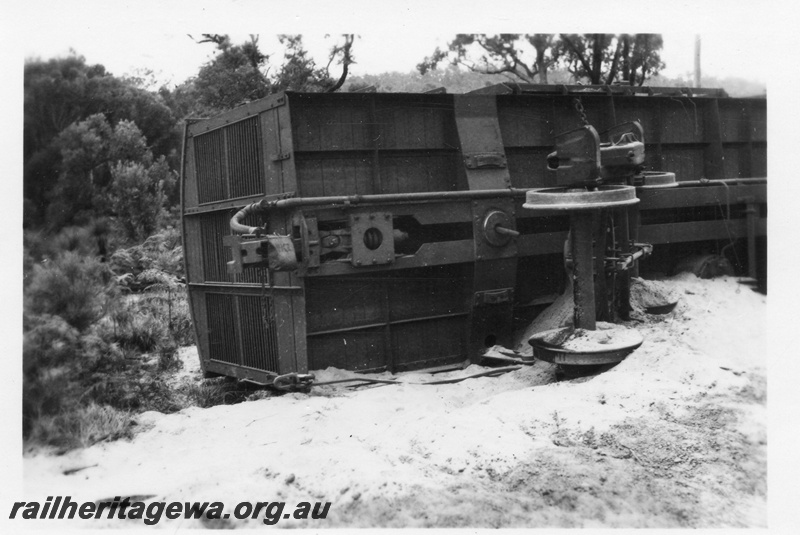 P02027
3 of 4 views of a derailment of No. 22 Fast Goods at the157-78 mile point on the Donnybrook to Katanning Railway, DK line, between Noggerup and Goonac, VD class bogie van on its side, , date of derailment 26/3/1955
