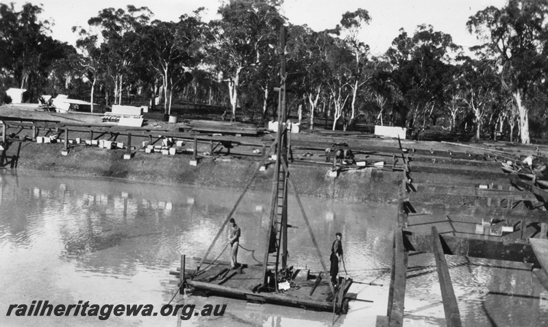 P02069
5 of 12 views of the construction of a railway dam at Hillman, BN line, front view of raft.
