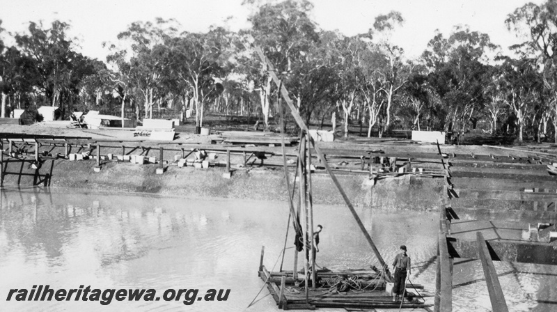 P02070
6 of 12 views of the construction of a railway dam at Hillman, BN line, side view of raft
