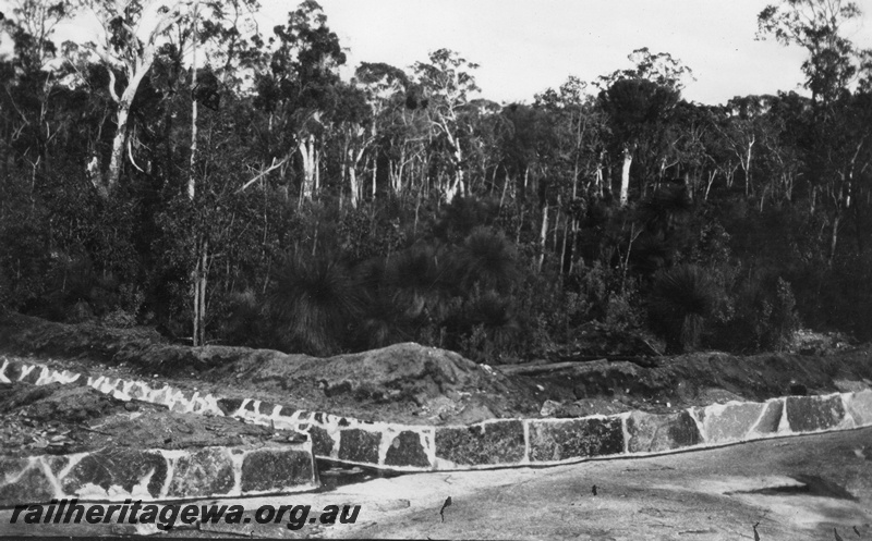 P02071
7 of 12 views of the construction of a railway dam at Hillman, BN line, contour wall and outlet from main rock
