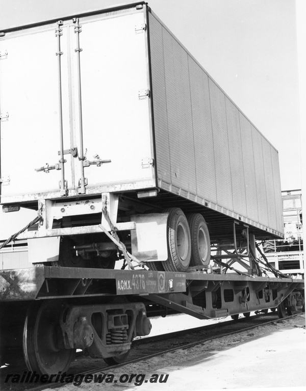 P02078
Semi trailer loaded onto a standard gauge flat wagon, Kewdale Piggy Back Area, view of the rear of the trailer
