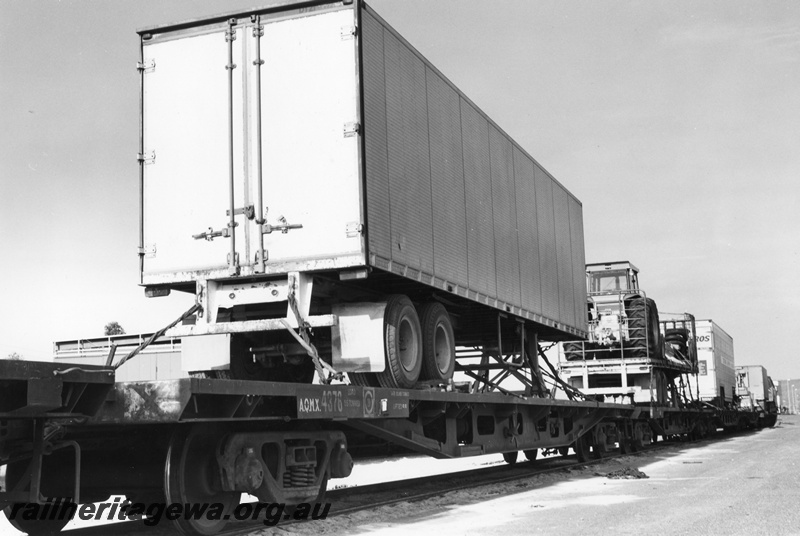 P02079
Semi trailer loaded onto a standard gauge flat wagon, Kewdale Piggy Back Area, view of the rear of the trailer
