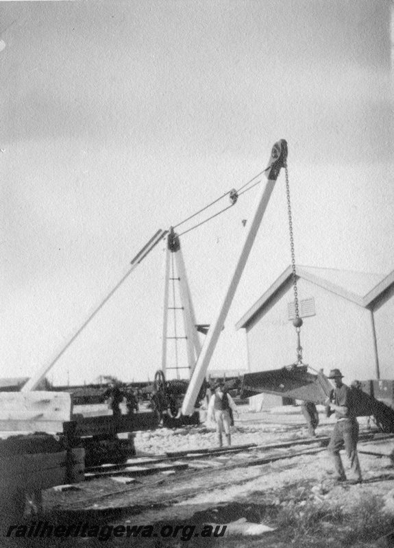 P02089
10 of 44 views of the construction of the railway at Esperance, CE line taken by Cedric Stewart, the resident WAGR engineer, derrick crane in operation, goods shed in the background.
