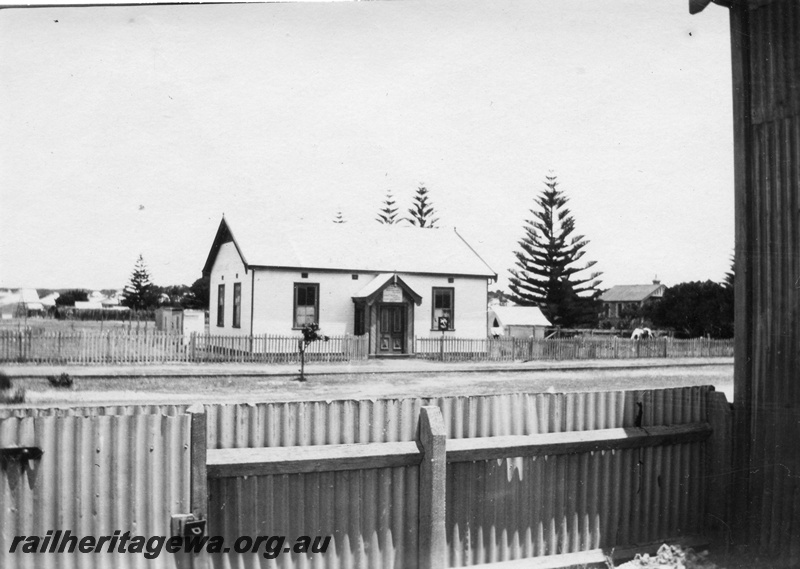 P02095
16 of 44 views of the construction of the railway at Esperance, CE line taken by Cedric Stewart, the resident WAGR engineer, building with indecipherable sign over the door, tents behind the building
