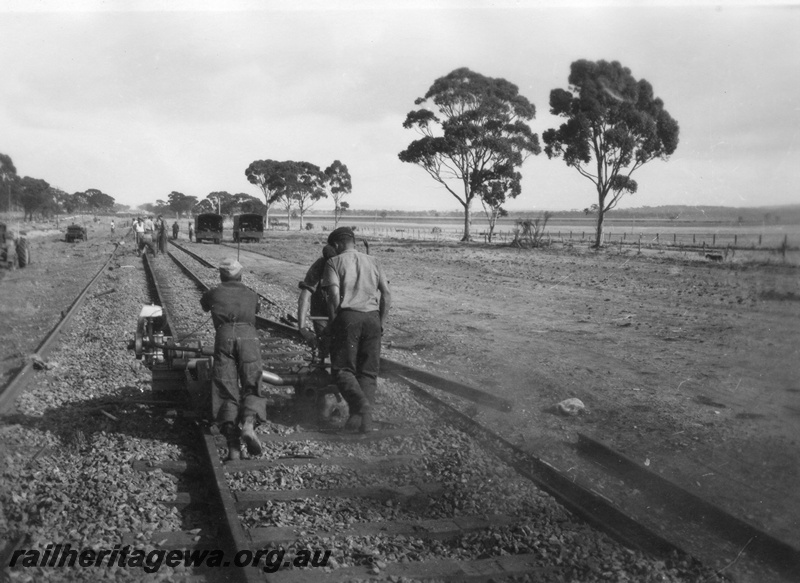 P02110
1 of 7 views of the early relaying of the track on the EGR, c1950, gangers operating a machine on the rails, view along the track
