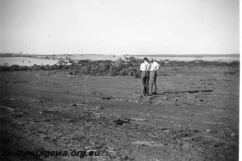 P02159
3 of 3 images of the construction of the water catchment at Kondinin, NKM line, two officials inspecting the 