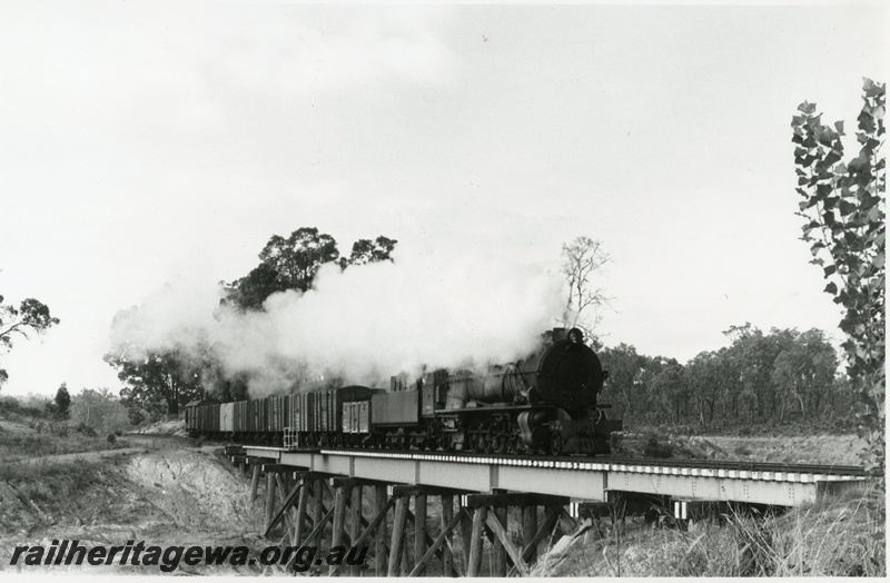 P02300
S class 548, steel girder bridge on timber piles, Collie, BN line short goods train
