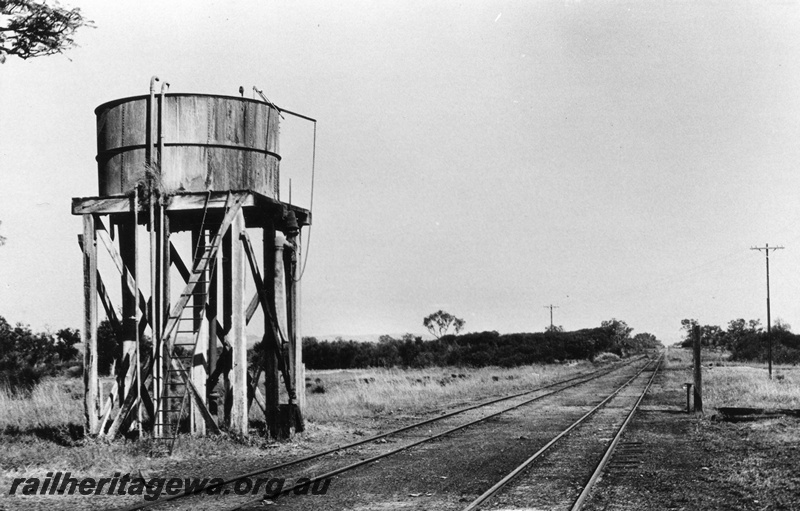 P02310
Water tower with a circular tank, location Unknown but possibly Muchea, MR line, end and trackside view.
