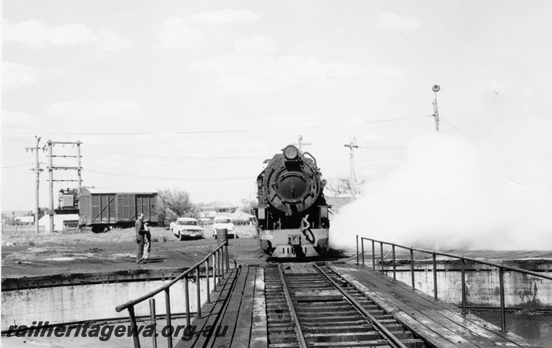 P02411
2 of 2. V class 1219 steam locomotive, front view, approaching turntable, louvered van in the background, Bunbury, SWR.
