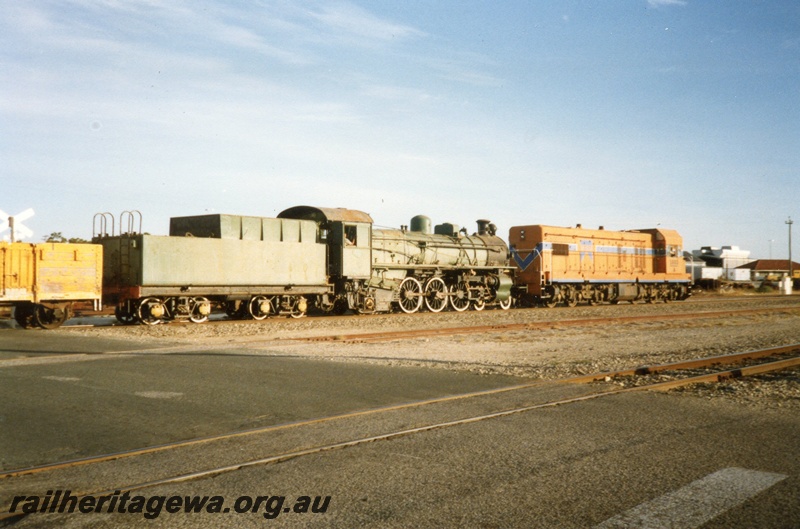 P02425
2 of 2. A class 1503 diesel locomotive hauling PM class 706 steam locomotive into Forrestfield, side view.
