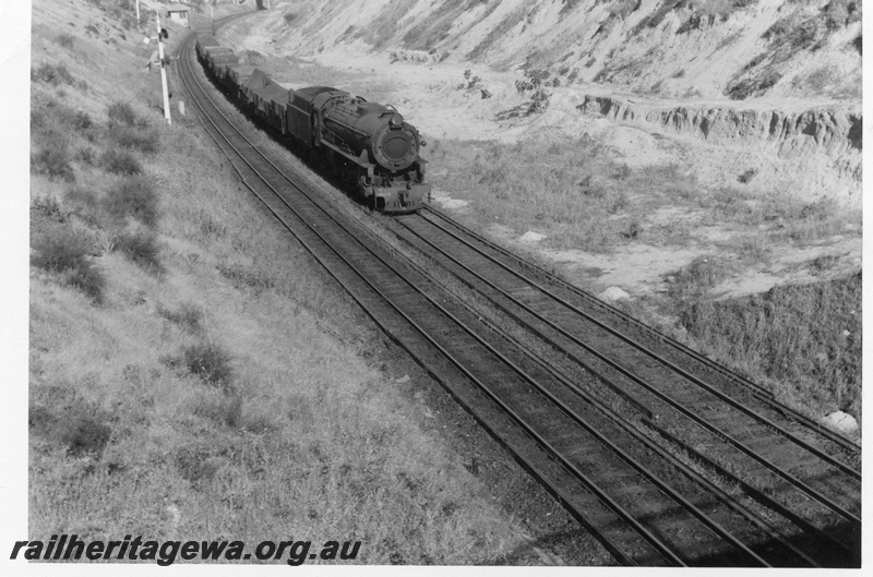 P02458
V class 1208, signal, goods train on the West Leederville Bank, heading west, view looking down on the train
