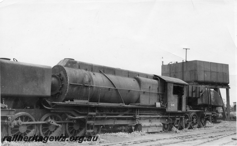 P02476
ASG G class 26 Garratt loco with full length cowling and rods removed, water tower with a 25,000 cast iron tank, front and side view.

