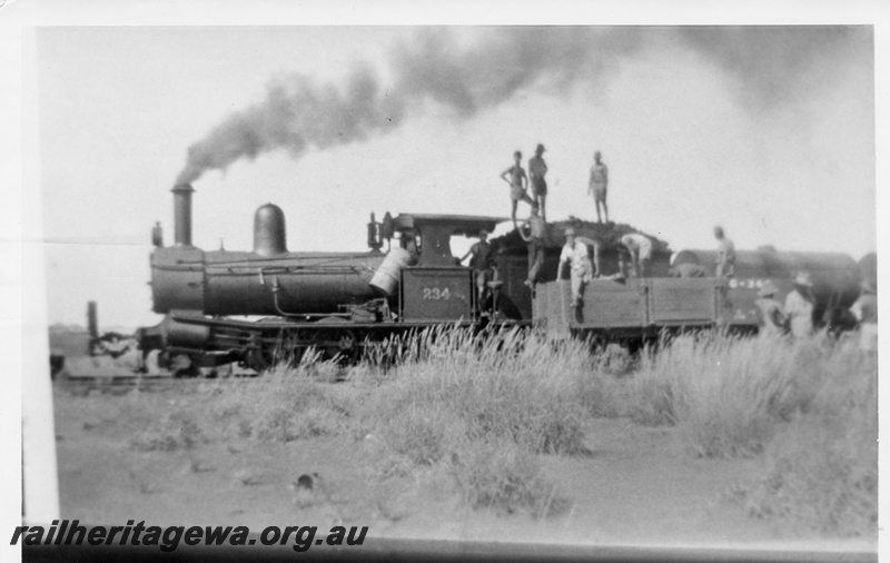 P02484
G class 234, number in large numerals on the cab side, PM line, side view, being coaled
