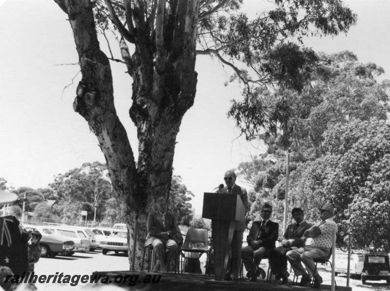 P02502
2 of 3 views of the ceremony to mark the centenary of the opening of the Fremantle to Guildford railway, Guildford, dignitaries on the  dais, Sir Paul Hasluck at the lectern
