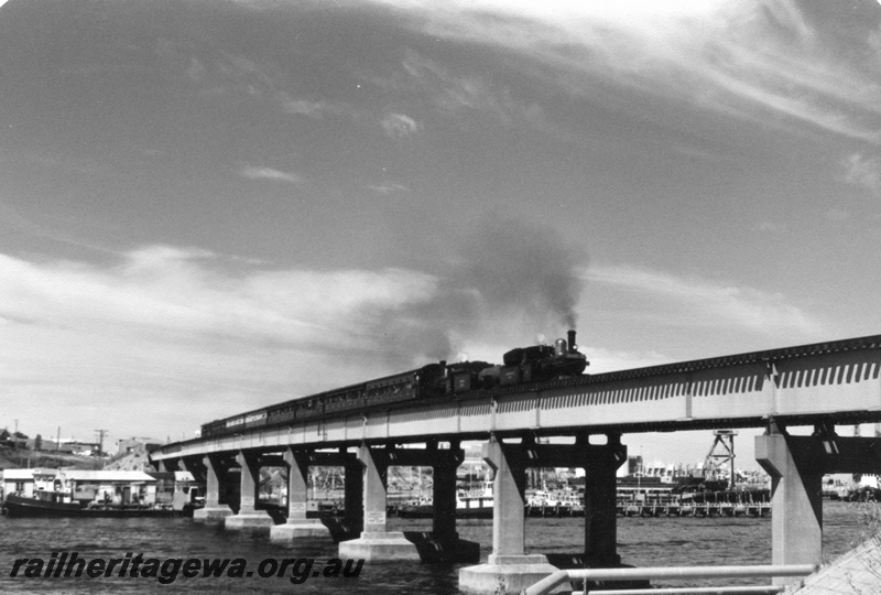 P02506
3 of 4 views of G class 233 and G class 123 back to back separated by a J class water tank wagon on the train to commemorate the centenary of the opening of the Fremantle to Guildford railway, on the Fremantle Bridge
