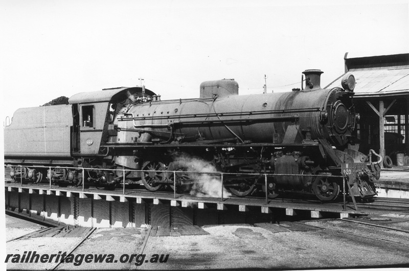 P02529
W class 920 steam locomotive on the turntable at Bunbury round house, side and front view, SWR line. c1970.
