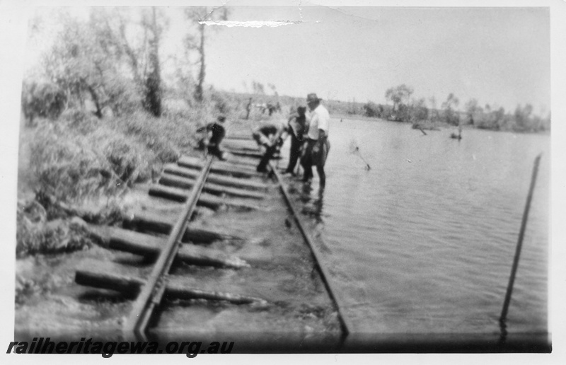 P02542
Flood damage to the track at Shaw River, track gang in attendance, PM line.
