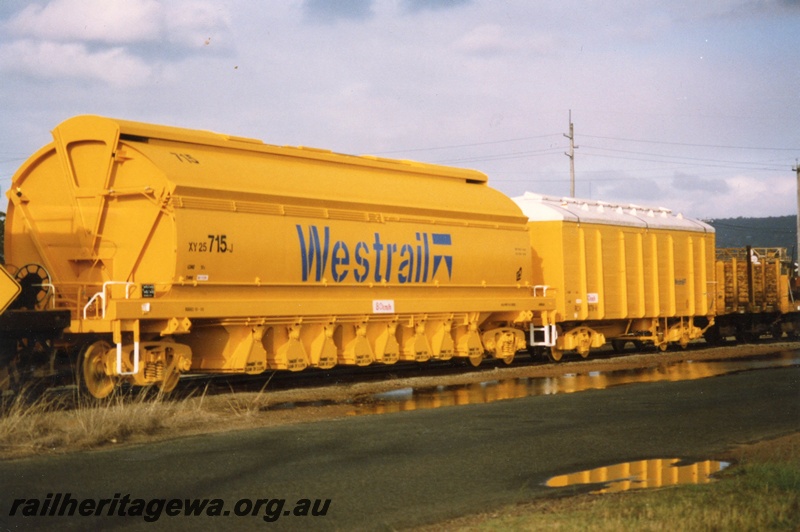 P02545
XY class 25 715J mineral sands/coal hopper, RCH class RCH wooden bodied bulk grain wagon with fibreglass roof, new yellow livery, end and side view, Midland Workshop.


