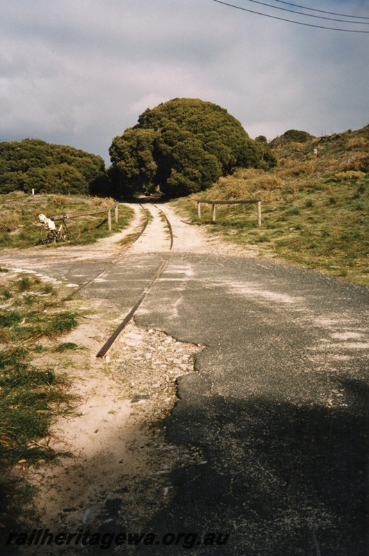 P02599
Trackwork, Rottnest Island Railway, view along the track at a level crossing.
