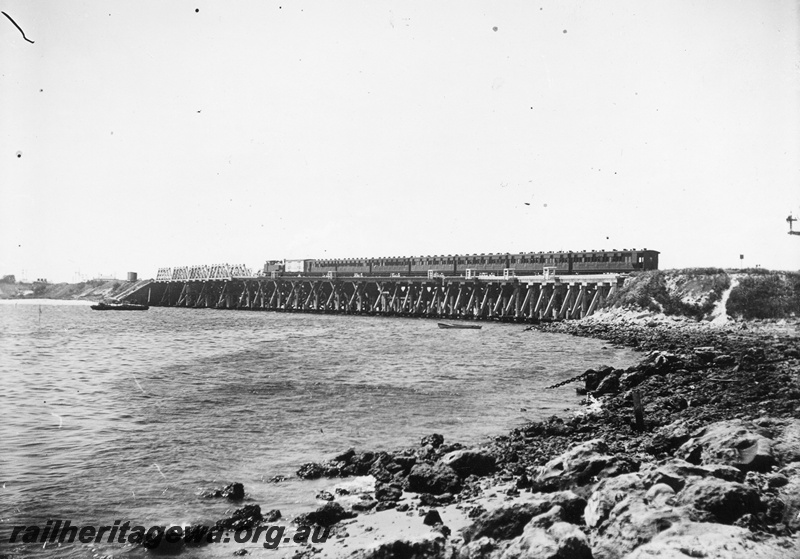 P02610
Passenger train on the trestle bridge crossing the Swan River at North Fremantle, overall view of the bridge, train heading for North Fremantle.
