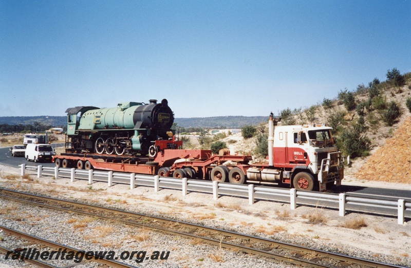 P02611
V class 1213 loco body on a low loader en route to Willis Light Engineering Works, view of the prime mover and trailer
