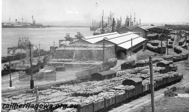 P02646
Open wagons loaded with bagged wheat, wheat stack, North Wharf Fremantle harbour.
