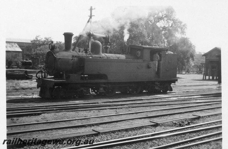 P02670
N class 260 steam locomotive, side view, water column and shed in the background, Midland Junction yards, ER line.
