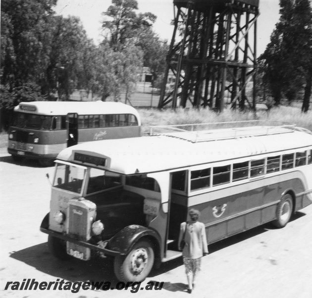 P02680
Railway Road Service bus Da30, Daimler, front and side view, water tower with 25,000 gallon cast iron water tank and a Metro bus in the background.
