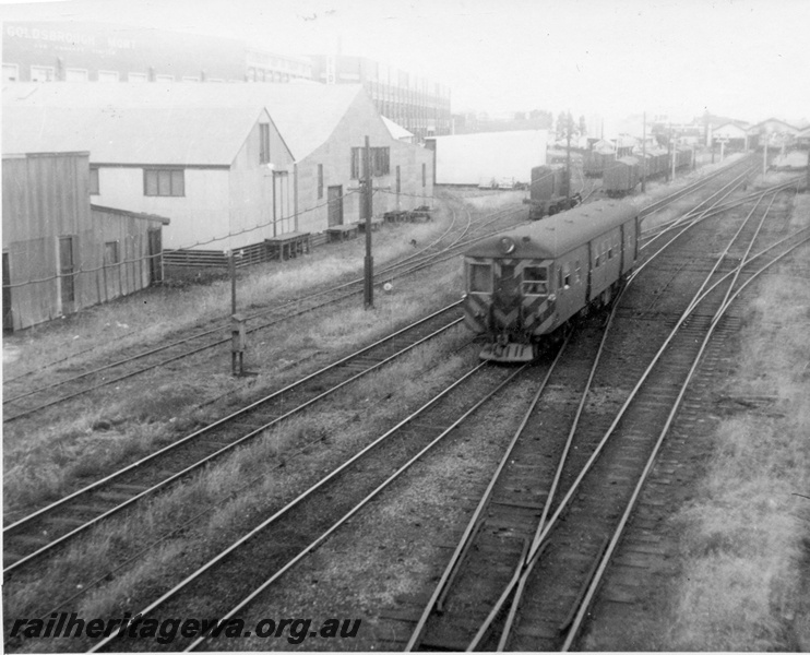 P02687
ADG class 601 diesel railcar, hazard stripes to the front, front and side view, Fremantle, ER line.
