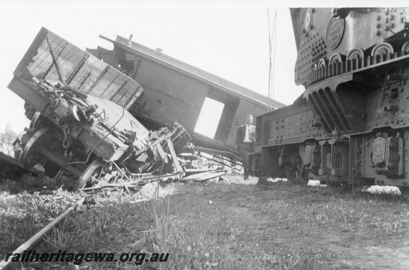 P02700
4 of 8. Rail smash at Yarloop. Brakevan of train No.21 on the front of W class 951 on train No.93, partial view of the break down crane including the maker's plate, SWR line.
