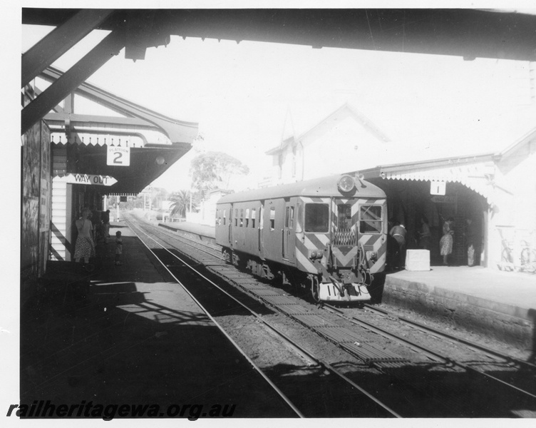 P02783
ADG class 611, plain green livery with black and yellow chevrons on the front, station buildings, Claremont, ER line, single car working.
