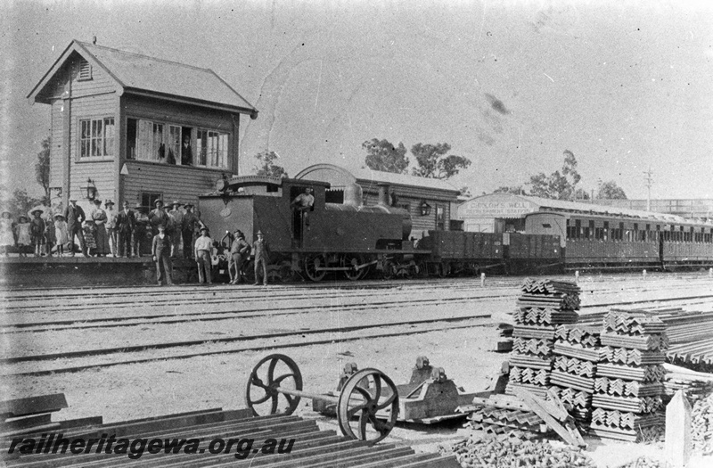 P02787
N class 261coupled to two open wagons and side loading carriages with sun shades over the windows, signal box, station building, Chidlow's Well, ER line, people standing on the platform and in front of the loco on the track, c1905, same as P4900
