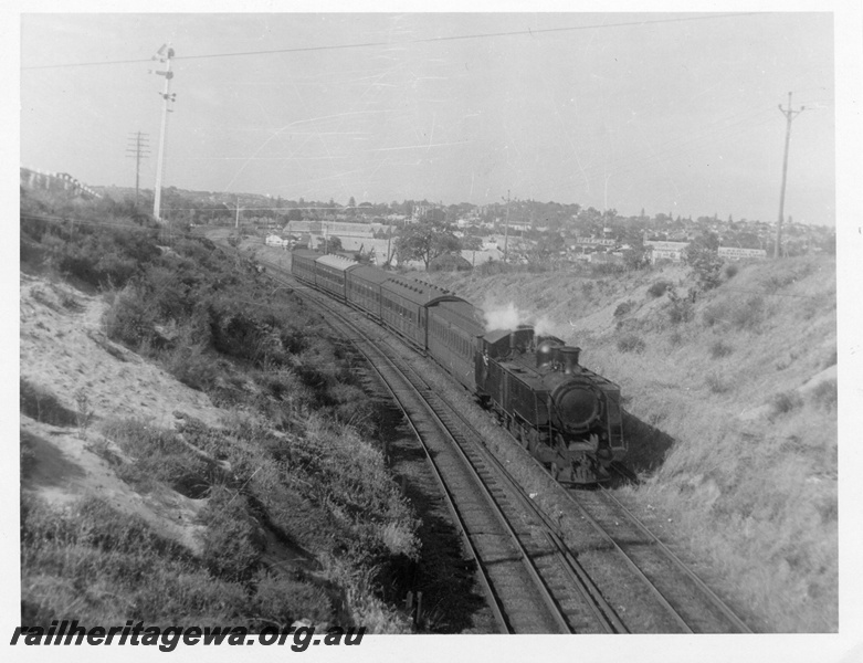 P02808
DM class 586, consist of AF class 261, AS class, AW class, AT class and one other, suburban passenger working, near Showgrounds, ER line, elevated view looking down on the train
