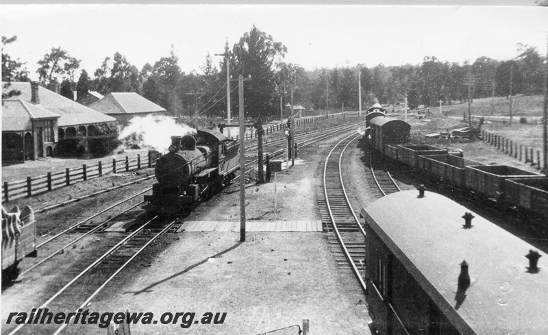 P02830
E class steam locomotive taking on water, good strain heading east, Chidlow, ER line.
