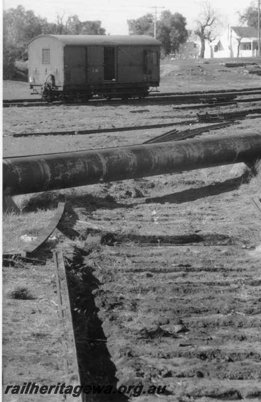 P02917
Z class brakevan, side view, lifted rail section of track, Coolgardie, EGR line, c1970.
