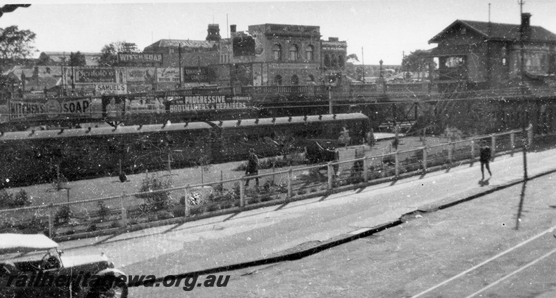 P02926
Perth station, signal box ('C' cabin), passenger train in the Armadale dock, view from Wellington St looking north east, ER line, c1920s.

