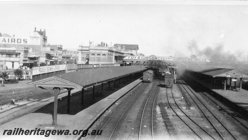 P02931
Perth station looking west, tracks, island platforms, station building end view, footbridge, signal rodding, ER line, early 1900s.
