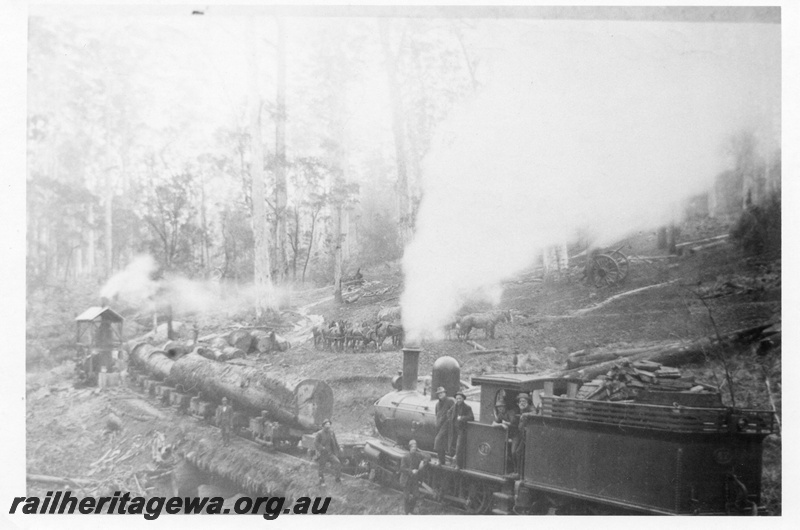 P02952
SSM G class 57 steam locomotive, hauling a rake of loaded jinkers, crew on the footplate, vertical steam boiler at a log landing, horse team, log bridge, whim, in the bush at Pemberton.
