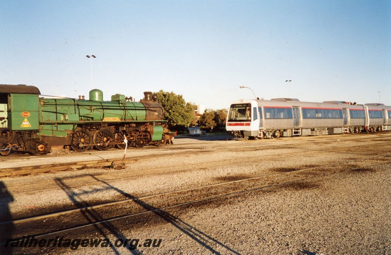 P02965
PM class 706 steam locomotive and new electrical multiple unit (EMU) railcars, side view, Forrestfield.
