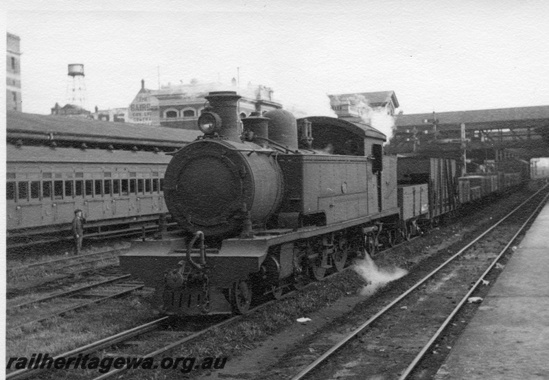 P02982
D class 387 steam locomotive on a goods train, front and side view, Perth, ER line.
