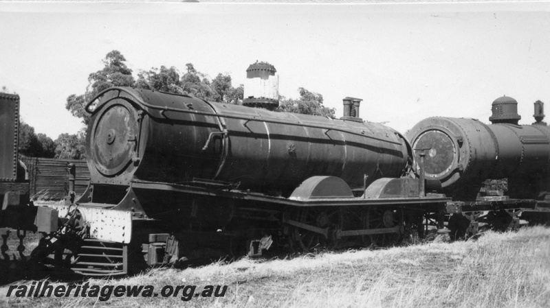 P02986
T class 169 steam locomotive, partly scrapped, on scrap siding, Midland, front and side view.
