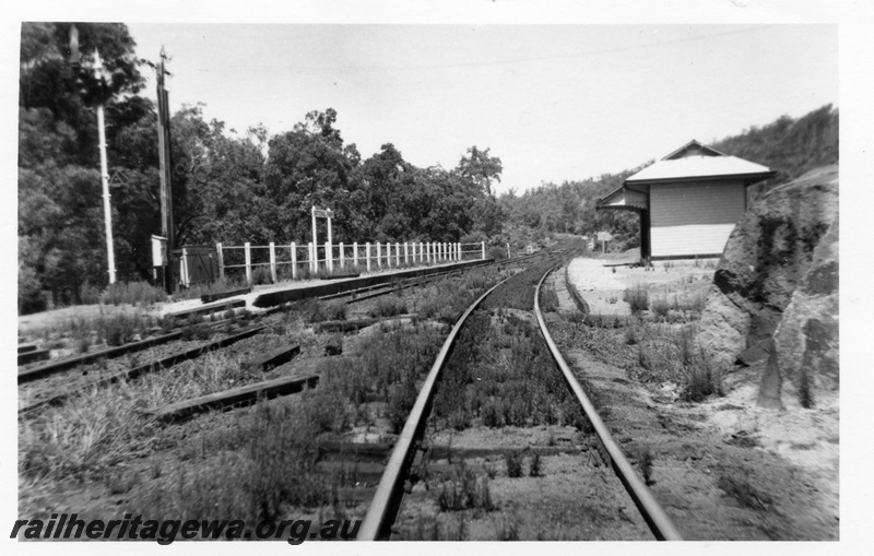 P02996
National Park station, signals, battery box, relay boxes, low level passenger platform, passenger shelter, nameboard, view looking east.
