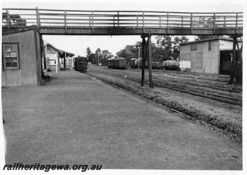 P03001
Armadale station with N class 75 steam locomotive running around the train, Out-of shed with a side window, nameboard, goods shed, footbridge, signal box, station building, passenger platform, Armadale, SWR line.
