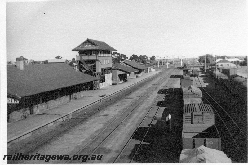 P03010
Yard and station buildings including signal box, passenger platform, signals and sidings Elevated view, Merredin, EGR line
