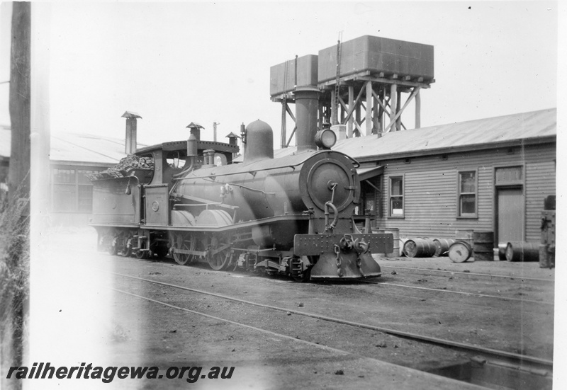 P03022
T class 171 steam locomotive, side and front view, twin water towers with 25,000 gallon cast iron tanks, Bunbury, SWR line.
