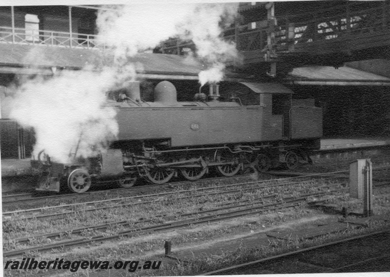 P03024
DM class 581 steam locomotive, running light engine, side view, footbridge, Perth station, ER line.
