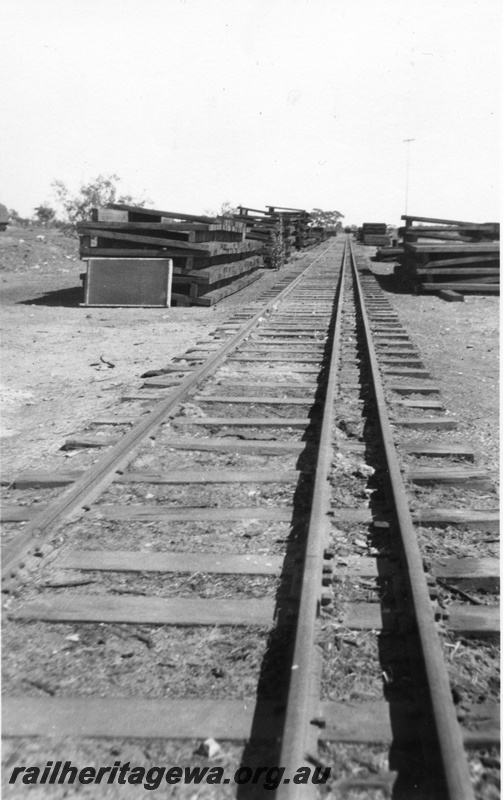 P03063
Sleeper stacks on both sides of the dual gauge tracks, Parkeston.

