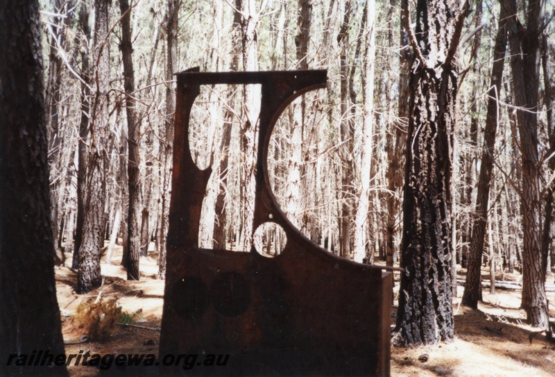 P03183
Left hand side of J class steam locomotive cab, Wuraming/Hakea forest.
