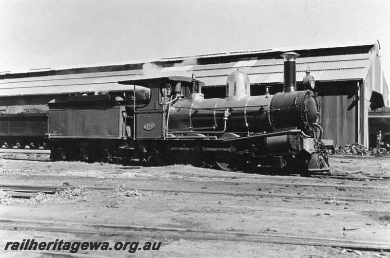 P03199
A class 15 steam locomotive, con rod missing, 6 wheel tender, side view.
