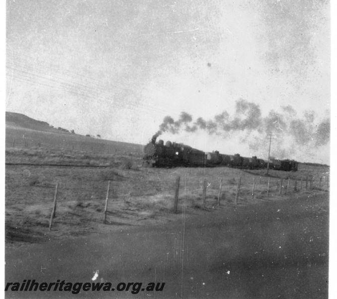 P03214
Goods train between Geraldton and Mullewa, front and side view, NR line, c1940s.
